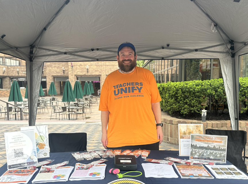 Josh Novick wearing a Teachers Unify t-shirt